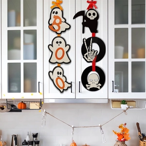 Detail of hanging Halloween wood signs with BOO ghost and grimaper on white kitchen cabinet