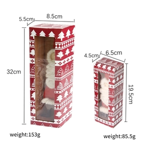 Felt Santa Claus figurines in red gift boxes with window display for Christmas decor