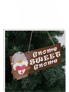 Detail of wooden Christmas gnome hanging sign with Gnome Sweet Gnome text on tree