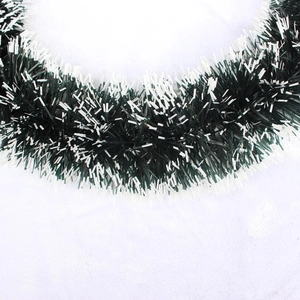 Close-up of lush 30cm green Christmas garland with snowy white tips and dense PVC needles