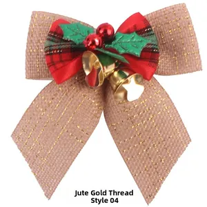Detail of Christmas burlap bow with gold thread red berries and golden metal bells