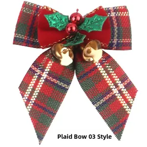 Detail of Christmas plaid burlap bow with holly berries and golden bells ornament
