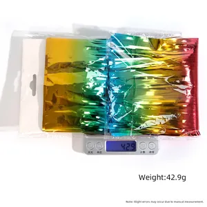 Detail of colorful rainbow foil fringe curtains for party decor in clear packaging