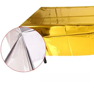 Close-up of dual-sided disposable rose gold and silver foil tablecloth for party decor