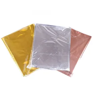 Three-color PET aluminum foil tablecloths in gold, silver, and copper folded packaging