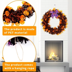 Halloween wreath with black orange tinsel and purple skull bow for party decor