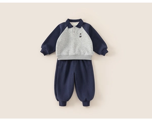 Detailed view of kids navy polo sweatshirt and jogger set with bear embroidery