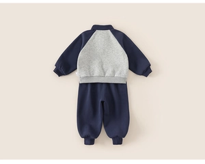Detail of girls' polo collar sweatshirt set with ribbed cuffs and soft knit fabric