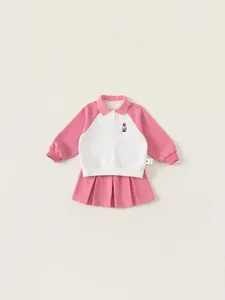 Girl's pink polo sweatshirt and pleated skirt set with cute bear embroidery detail