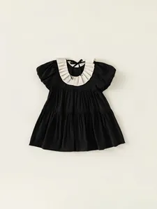 Elegant black puff sleeve dress for girls with white pleated collar and tiered skirt