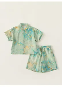 Detail of light green boy's Hanfu set with traditional mountain landscape ink print pattern