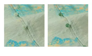 Close-up of traditional jade-style buttons and landscape print on boys' Hanfu fabric