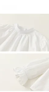 Close-up of cotton shirt collar and ruffled cuffs with delicate texture details