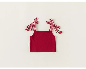 Detail of red ribbed knit girls tank top with checkered bow straps and cherry accents