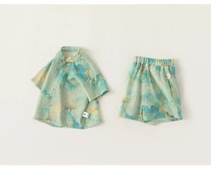 Detailed view of mint green kids' summer hanfu set with traditional landscape print