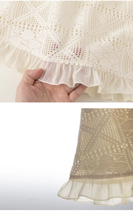 Detailed view of cream crochet lace hem with delicate hollow patterns and chiffon ruffles