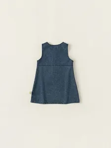 Classic blue washed denim jumper dress for girls with minimalist A-line cut and side tag