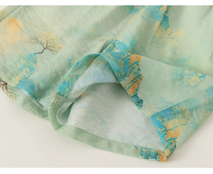 Close-up of children's traditional Chinese suit with green mountain landscape print