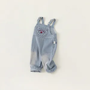 Girls denim overalls with cherry heart patch and adjustable straps in blue wash