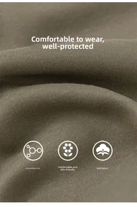 Close-up of olive green knit cotton fabric showing soft texture and premium fiber detail