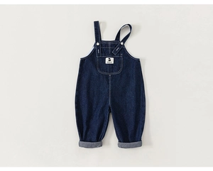 Detailed view of dark blue denim baby overalls with Babycity label and rolled cuffs