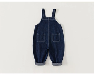 Detailed view of dark blue denim overalls for children featuring adjustable straps and pockets