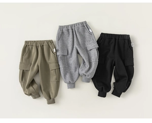Detailed view of three-color cargo jogger pants for boys featuring large side pockets