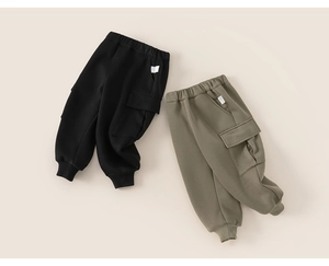 Detail showing elastic waist and cargo pocket on black and olive green boys pants