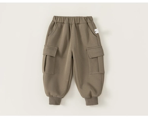 Detail of olive brown kids cargo jogger pants showing elastic waist and utility pockets
