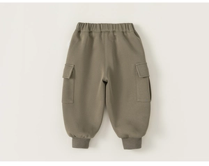 Detailed macro view of olive green cargo sweatpants featuring elastic cuffs and side pockets