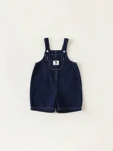 Classic dark blue denim baby overalls with contrast stitching and adjustable straps