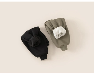Detailed view of fleece lining on black and olive green thermal cargo pants for boys