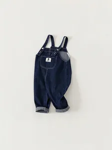 Classic dark blue denim overalls for toddlers with chest pocket and folded cuffs