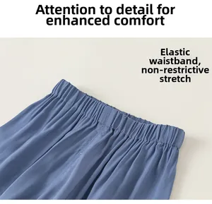 Close-up of elastic waistband on blue breathable mosquito pants with premium stitching