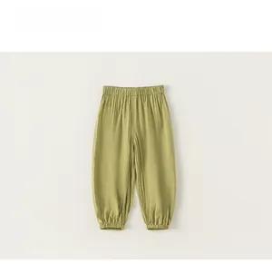 Close-up of olive green kids anti-mosquito pants with elastic waist and gathered cuffs