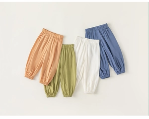 Flat lay of lightweight cotton linen mosquito pants for kids in four assorted colors