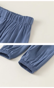 Detail of blue breathable kids mosquito pants with elastic waistband and cuffs