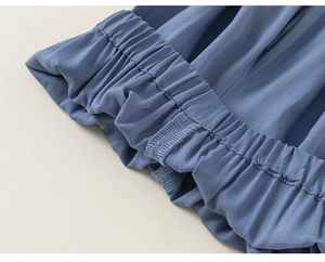 Detailed close-up of blue kids mosquito pants with elastic waistband and sewing details