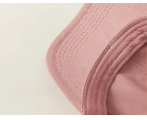 Close-up of pink cotton baseball cap showing fine stitching and breathable inner lining