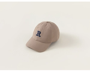 Detail of khaki cotton baseball cap featuring 3D navy blue embroidered R letter logo