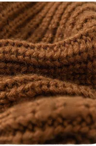Close-up of soft brown knit sweater fabric with skin-friendly and formaldehyde-free texture