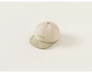 Detail of baby baseball cap with 'GOOD DAY' embroidery and two-tone color design