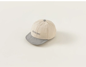 Detailed shot of two-tone baby sun hat with GOOD DAY embroidery and breathable fabric