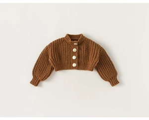 Detailed view of caramel brown knit cardigan with lantern sleeves and metal buttons