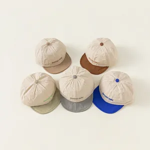 Set of 5 minimalist cotton baby baseball caps with GOOD DAY embroidery in various colors