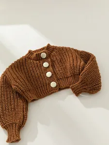 Chunky knit dark brown cardigan for girls with white buttons and puff sleeves