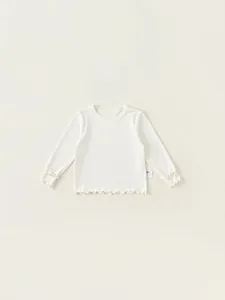 Maglia bianca a maniche lunghe in cotone per bambina con bordi a balze eleganti
