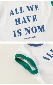 Detail of white cotton boy's tank top showing blue neck binding and green ribbed cuffs