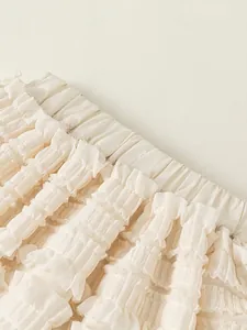 Sweet cream layered ruffle cake skirt for girls featuring elegant chiffon pleats