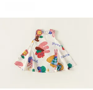 Detail view of cotton sleeveless dress featuring colorful cartoon sun and rabbit patterns